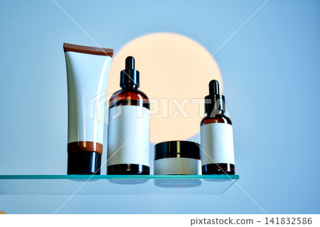 Skincare cosmetics bottles and tube on glass shelf Skincare cosmetics bottles and tube on glass shelf 141832586