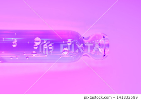 Cosmetic serum bubbles inside a glass pipette Cosmetic serum bubbles inside a glass pipette 141832589