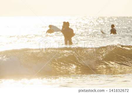 Waves illuminated by the setting sun at Kugenuma Beach, Shonan. Waves illuminated by the setting sun at Kugenuma Beach, Shonan. 141832672