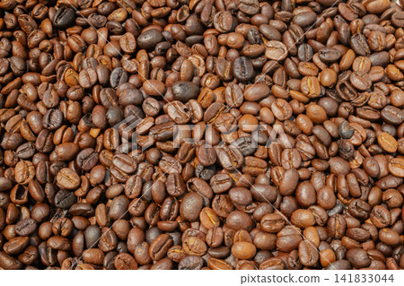 Fresh premium roasted brown Arabica coffee beans background Fresh premium roasted brown Arabica coffee beans background 141833044