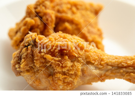 crispy fried chicken on white plate close up crispy fried chicken on white plate close up 141833085