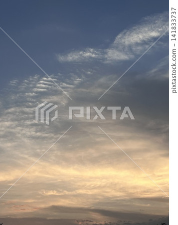 Beautiful clouds and sky softly tinged with the twilight light. Beautiful clouds and sky softly tinged with the twilight light. 141833737