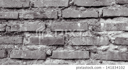 Monochrome old brick wall with mortar joints Monochrome old brick wall with mortar joints 141834102