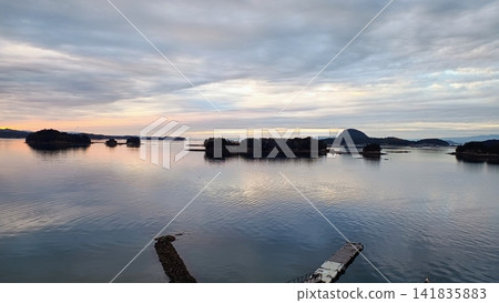 A landscape of Amakusa, Kumamoto Prefecture, with islands floating in the sea at dusk. A landscape of Amakusa, Kumamoto Prefecture, with islands floating in the sea at dusk. 141835883