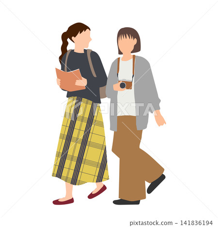 Two young women walking through the autumn streets. Two young women walking through the autumn streets. 141836194