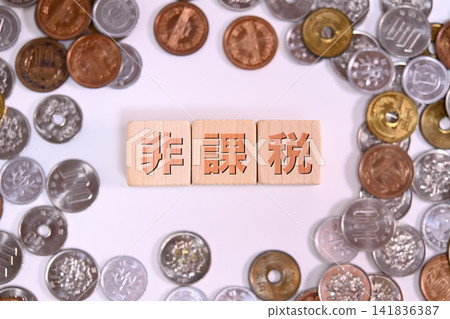Tax-free text and Japanese yen coins Tax-free text and Japanese yen coins 141836387