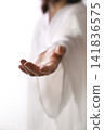 The gesture of Jesus Christ reaching out in the bright light, guiding to the path of life, Easter background 141836575