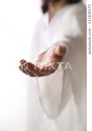 The gesture of Jesus Christ reaching out in the bright light, guiding to the path of life, Easter background The gesture of Jesus Christ reaching out in the bright light, guiding to the path of life, Easter background 141836575