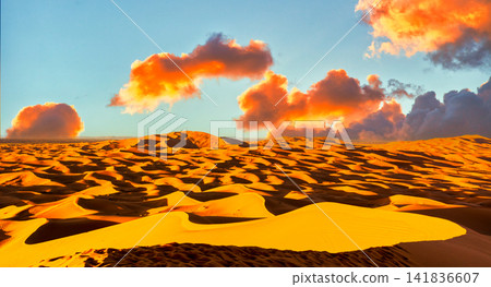 A beautiful sunset scene in the scorching Sahara Desert. A beautiful sunset scene in the scorching Sahara Desert. 141836607