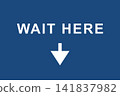 "WAIT HERE" sign indicating the waiting area. 141837982