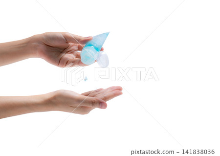 Woman hand holding hand sanitizer and drop on palm to kill coronavirus. Cleaning hands with alcohol gel to protect from germs, virus, and bacteria. Personal hygiene to prevent coronavirus or flu. Woman hand holding hand sanitizer and drop on palm to kill coronavirus. Cleaning hands with alcohol gel to protect from germs, virus, and bacteria. Personal hygiene to prevent coronavirus or flu. 141838036