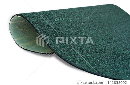 Selective focus on hunter green color shingle roof on white background. Roofing material. Shingle roof texture. Shingle roof made from asphalt, plastic fiberglass. Rough dark green granules surface. Selective focus on hunter green color shingle roof on white background. Roofing material. Shingle roof texture. Shingle roof made from asphalt, plastic fiberglass. Rough dark green granules surface. 141838092
