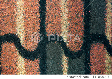 Shingle roof texture background. Roofing material. Dense of rough brown, green, black, yellow granules surface of shingle roof texture background. Shingle roof made of asphalt, plastic fiberglass. Shingle roof texture background. Roofing material. Dense of rough brown, green, black, yellow granules surface of shingle roof texture background. Shingle roof made of asphalt, plastic fiberglass. 141838094