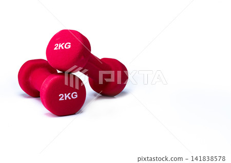 Red neoprene weight training dumbbells isolated on white background, versatile fitness equipment for home gyms, resistance exercise, body sculpting and improving strength, endurance and performance. 141838578