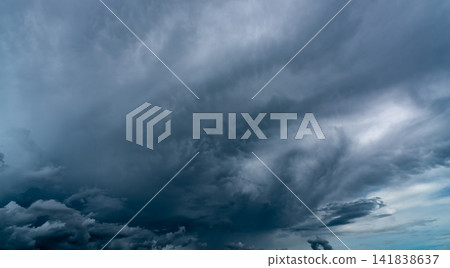 Dark dramatic sky and clouds. Background for death and sad concept. Gray sky and fluffy white clouds. Thunder and storm sky. Sad and moody sky. Nature background. Dead abstract background. Cloudscape. Dark dramatic sky and clouds. Background for death and sad concept. Gray sky and fluffy white clouds. Thunder and storm sky. Sad and moody sky. Nature background. Dead abstract background. Cloudscape. 141838637