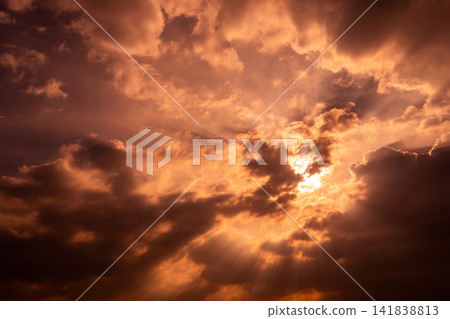 God light. Dark cloudy sky with sun beam. Sun rays through dark clouds. God light from heaven for hope and faithful concept. Believe in god. Heaven sky. Sunset sky. Spiritual religious background. God light. Dark cloudy sky with sun beam. Sun rays through dark clouds. God light from heaven for hope and faithful concept. Believe in god. Heaven sky. Sunset sky. Spiritual religious background. 141838813