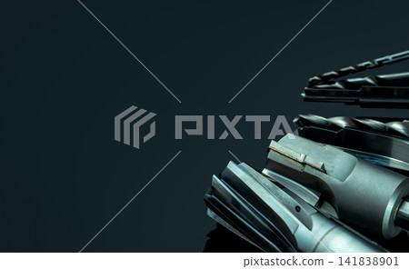 Special tools isolated on dark background. Made to order special tools. Coated step drill and reamer detail. HSS cemented carbide. Carbide cutting tool for industrial applications. Engineering tools. Special tools isolated on dark background. Made to order special tools. Coated step drill and reamer detail. HSS cemented carbide. Carbide cutting tool for industrial applications. Engineering tools. 141838901