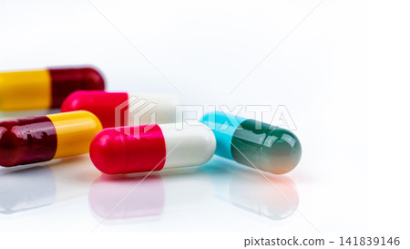Colorful pharmaceutical capsule medication on white background, healthcare and pharmacy concept for prescription medicine, hospital treatment and medical industry. Pharmaceutical industry. Colorful pharmaceutical capsule medication on white background, healthcare and pharmacy concept for prescription medicine, hospital treatment and medical industry. Pharmaceutical industry. 141839146