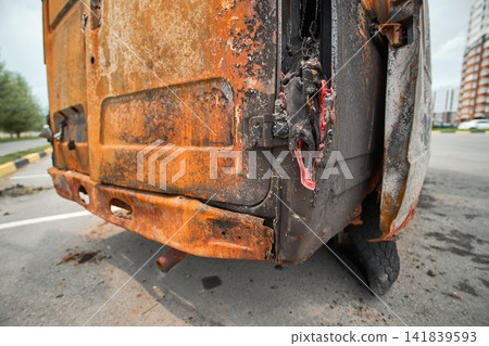 Melted Plastic and Burned Trash on a Charred Vehicle Floor Melted Plastic and Burned Trash on a Charred Vehicle Floor 141839593