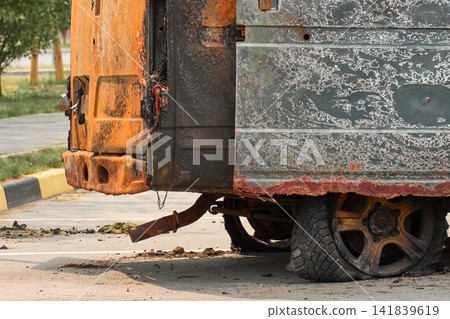 Abandoned Wreck of a Burnt Commercial Vehicle on City Street Abandoned Wreck of a Burnt Commercial Vehicle on City Street 141839619