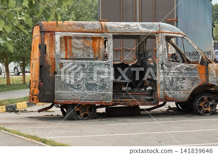 Abandoned Wreck of a Burnt Commercial Vehicle on City Street Abandoned Wreck of a Burnt Commercial Vehicle on City Street 141839646