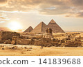 Great Sphinx of Giza and Ancient Pyramids in Egypt Desert Sunset Landscape 141839688