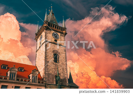 Old Town Hall Tower against fiery orange storm clouds in Prague Old Town Hall Tower against fiery orange storm clouds in Prague 141839903