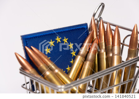 Shopping cart filled with rifle cartridges and European Union flag patch Shopping cart filled with rifle cartridges and European Union flag patch 141840521