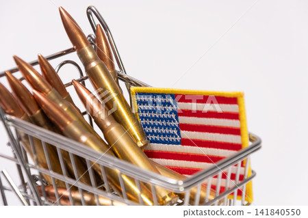Rifle cartridges and American flag patch packed inside miniature shopping cart Rifle cartridges and American flag patch packed inside miniature shopping cart 141840550