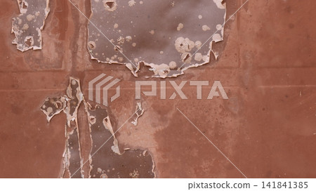 an old, rusty, brown metal surface. The metal shows areas of heavily peeling and flaking paint, dark spots of corrosion, small cracks, plaque, and traces of weathering. an old, rusty, brown metal surface. The metal shows areas of heavily peeling and flaking paint, dark spots of corrosion, small cracks, plaque, and traces of weathering. 141841385