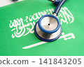 Saudi Arabia flag with black stethoscope, Business and finance concept. 141843205