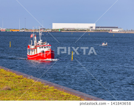 Red Fishing Boat Sailing in Copenhagen Harbor Denmark Red Fishing Boat Sailing in Copenhagen Harbor Denmark 141843658