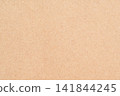 A background with the natural texture of beige kraft paper made from recycled fibers. 141844245