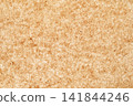 The texture of natural handmade paper with warm brown fibers. 141844246