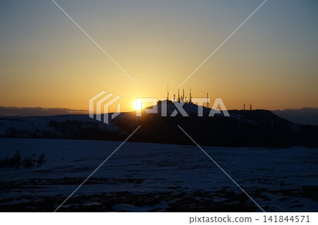 Sunset sinking into the winter sky Sunset sinking into the winter sky 141844571