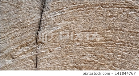 Rough, light-cream concrete wall with horizontal lines and cracks. Rough, light-cream concrete wall with horizontal lines and cracks. 141844767