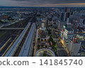 An aerial view of the city center at twilight, with light trails remaining in the station square in front of Koriyama Station's west exit [Koriyama Station, Fukushima Prefecture] 141845740
