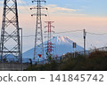 Mount Fuji and power lines bathed in the sunset. 141845742