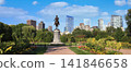 Boston's Public Garden with George Washington sculpture and city skyline on the background 141846658