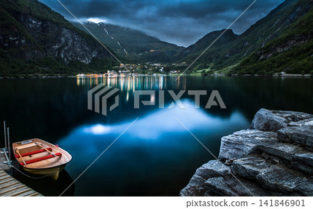 Fjord Lake at Blue Hour with Rowboat and Mountain Village Fjord Lake at Blue Hour with Rowboat and Mountain Village 141846901