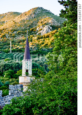 Islamic mosque temple minaret in city Bar Montenegro, mountain view background Islamic mosque temple minaret in city Bar Montenegro, mountain view background 141847167