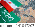 National flag of Iran and Saudi Arabia on the world map background. Iran and USA conflict and crisis.  141847207