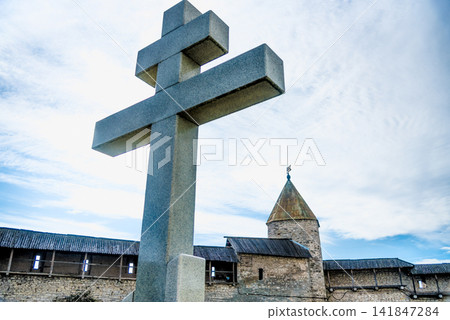 Orthodox religious Christian large stone cross is installed outside church Orthodox religious Christian large stone cross is installed outside church 141847284