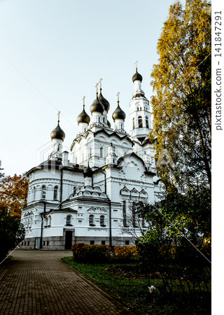 Orthodox cathedral church kirk with golden domes and crosses, exterior outside 141847291