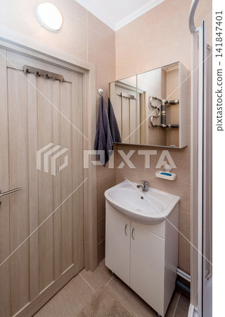 Simple bathroom interior in residential building, toilet design hotel apartment Simple bathroom interior in residential building, toilet design hotel apartment 141847401
