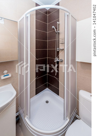 Simple bathroom interior in residential building, toilet design hotel apartment Simple bathroom interior in residential building, toilet design hotel apartment 141847402