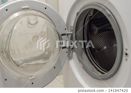 Rubber gasket washing machine drum covered with mold and limescale of hard water Rubber gasket washing machine drum covered with mold and limescale of hard water 141847420
