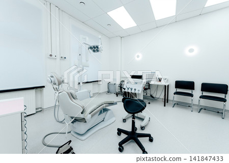 Dental equipment in light dentist office in modern stomatological clinic room Dental equipment in light dentist office in modern stomatological clinic room 141847433