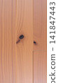 close-up of rustic wooden panel with natural knots in indoor setting, natural and warm tones, for interior design and furniture display, modern and detailed visual resource. 141847443