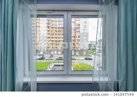 Bedroom window of residential apartment overlooking courtyard residential area Bedroom window of residential apartment overlooking courtyard residential area 141847549